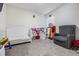 bedroom with crib, armchair, and toys at 16838 Delia St, Wimauma, FL 33598
