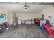 Attached garage with washer, dryer, and workbench at 16838 Delia St, Wimauma, FL 33598