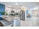 Modern kitchen with stainless steel appliances and granite countertops at 16838 Delia St, Wimauma, FL 33598