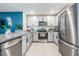 Modern kitchen with stainless steel appliances and granite countertops at 16838 Delia St, Wimauma, FL 33598