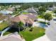 Aerial view of house and surrounding neighborhood at 2012 Fern Ridge Ct, Holiday, FL 34691
