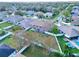 Aerial view of a house with a large backyard at 2012 Fern Ridge Ct, Holiday, FL 34691