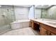 Elegant bathroom with double sinks, soaking tub and walk-in shower at 2012 Fern Ridge Ct, Holiday, FL 34691