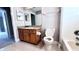 Bathroom with granite countertop, toilet and bathtub at 2012 Fern Ridge Ct, Holiday, FL 34691