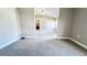 Spacious bedroom with carpet flooring and access to an ensuite bathroom at 2012 Fern Ridge Ct, Holiday, FL 34691