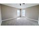 Bright bedroom featuring neutral walls and carpet flooring at 2012 Fern Ridge Ct, Holiday, FL 34691
