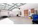 Spacious garage with extra storage cabinets at 2012 Fern Ridge Ct, Holiday, FL 34691