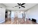 Living room featuring hardwood floors, ceiling fan, and open floor plan at 2012 Fern Ridge Ct, Holiday, FL 34691