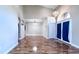 Spacious living room featuring hardwood floors and an abundance of natural light at 2012 Fern Ridge Ct, Holiday, FL 34691