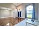 Bright living room with hardwood floors, high ceilings, and access to backyard at 2012 Fern Ridge Ct, Holiday, FL 34691