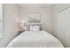 Cozy bedroom featuring a queen-size bed and neutral color palette at 21149 Pleasant Plains Pkwy, Land O Lakes, FL 34637