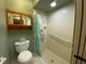 Bathroom features shower stall, toilet, and linen storage at 2170 Bancroft Pl # B, Palm Harbor, FL 34683