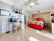 Bedroom with workspace and wood accent wall at 2467 Finlandia Ln # 9, Clearwater, FL 33763