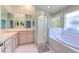 Bathroom with a large soaking tub, shower, and double vanity at 3125 Bent Creek Dr, Valrico, FL 33596