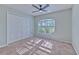 Bright bedroom featuring a large window and ample closet space at 3125 Bent Creek Dr, Valrico, FL 33596