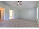 Primary bedroom with carpet flooring and an ensuite bathroom at 3125 Bent Creek Dr, Valrico, FL 33596