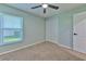 Well-lit bedroom with ceiling fan and neutral decor at 3125 Bent Creek Dr, Valrico, FL 33596