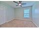 Bedroom with ceiling fan, window with blinds, and neutral-toned carpet at 3125 Bent Creek Dr, Valrico, FL 33596