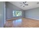 Bright bedroom with hardwood floors and large window at 3125 Bent Creek Dr, Valrico, FL 33596