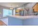 Kitchen features light wood cabinets and a breakfast bar at 3125 Bent Creek Dr, Valrico, FL 33596
