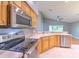 Kitchen with stainless steel appliances and wood cabinets at 3125 Bent Creek Dr, Valrico, FL 33596