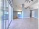 Open concept living space with tile floors and high ceilings at 3125 Bent Creek Dr, Valrico, FL 33596