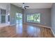 Living room featuring hardwood floors and large windows at 3125 Bent Creek Dr, Valrico, FL 33596