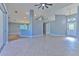 Open living room with tile floors and access to patio at 3125 Bent Creek Dr, Valrico, FL 33596