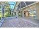 Spacious screened patio with brick pavers and access to backyard at 3125 Bent Creek Dr, Valrico, FL 33596