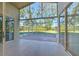 Bright screened patio overlooking the backyard at 3125 Bent Creek Dr, Valrico, FL 33596