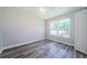 Bright bedroom features modern flooring, new windows, and freshly painted walls at 3562 Fisher Rd, Palm Harbor, FL 34683