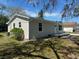 Well-maintained home featuring a neutral exterior, manicured lawn, and classic curb appeal at 3562 Fisher Rd, Palm Harbor, FL 34683