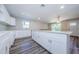 Newly installed kitchen with white cabinets, granite countertops, and modern appliances at 3562 Fisher Rd, Palm Harbor, FL 34683