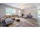 Bright living room showcasing a neutral color palette and ample natural light from the large window at 3562 Fisher Rd, Palm Harbor, FL 34683