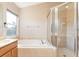 Bathroom with bathtub, shower, and double sinks at 3602 Morgans Bluff Ct, Land O Lakes, FL 34639