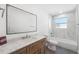 Clean bathroom with a soaking tub and modern vanity at 3819 Scovill Ln, Valrico, FL 33596