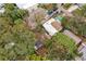 Aerial view of a single-story home with surrounding trees and neighboring houses at 392 Kentucky Ave, Crystal Beach, FL 34681