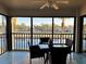 Inviting dining area with a glass table and seating for four, offering picturesque views of the community at 4452 Weybridge St # 74, Sarasota, FL 34235