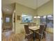 Bright dining room with access to the kitchen and natural light at 4452 Weybridge St # 74, Sarasota, FL 34235