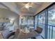 Relaxing screened lanai with comfortable seating overlooking a peaceful waterfront at 4452 Weybridge St # 74, Sarasota, FL 34235