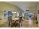 Spacious living and dining area with vaulted ceilings, hardwood floors, and serene natural light at 4452 Weybridge St # 74, Sarasota, FL 34235