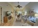 Spacious living room with vaulted ceilings, hardwood floors, and comfortable seating at 4452 Weybridge St # 74, Sarasota, FL 34235