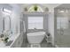 Spa-like bathroom with a freestanding tub, walk-in shower, and modern fixtures at 5112 Teather St, Spring Hill, FL 34608