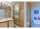 Clean bathroom with shower and toilet, featuring light colored tiles at 7050 Sunset S Dr # 405, South Pasadena, FL 33707