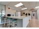 Well-equipped community kitchen with breakfast bar at 7050 Sunset S Dr # 405, South Pasadena, FL 33707