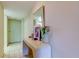 Bright entryway with a contemporary console table and mirror at 7050 Sunset S Dr # 405, South Pasadena, FL 33707