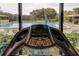 Treadmill overlooking a resort-style pool at 7050 Sunset S Dr # 405, South Pasadena, FL 33707