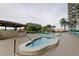 Community hot tub and pool area at 7050 Sunset S Dr # 405, South Pasadena, FL 33707