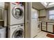 Convenient laundry area with stackable washer and dryer at 7050 Sunset S Dr # 405, South Pasadena, FL 33707