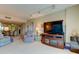 Living room with comfortable seating, large TV and view of dining area at 7050 Sunset S Dr # 405, South Pasadena, FL 33707